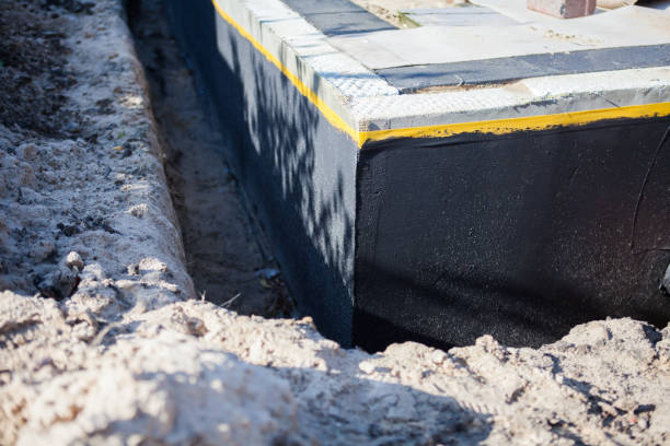 Professional Waterproofing technician working in Romulus, NY
